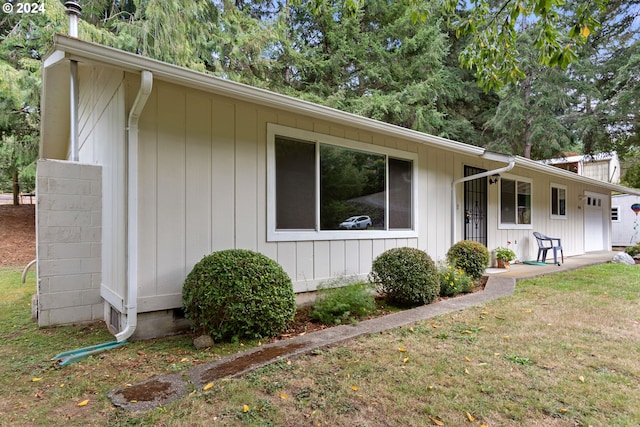 view of home's exterior featuring a yard