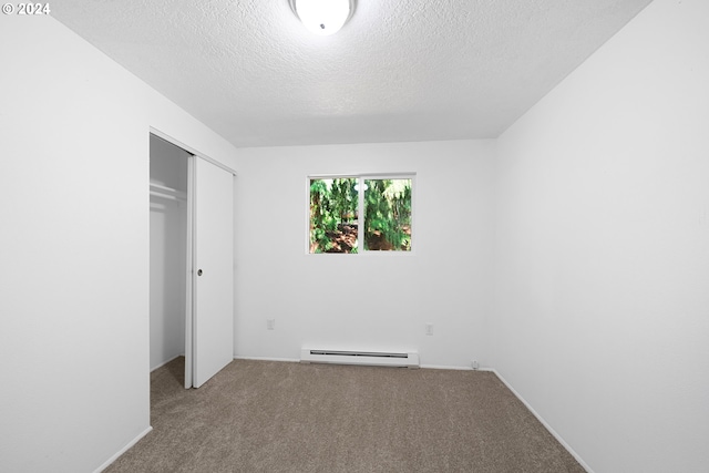 unfurnished bedroom featuring carpet floors, a baseboard radiator, a closet, and a textured ceiling