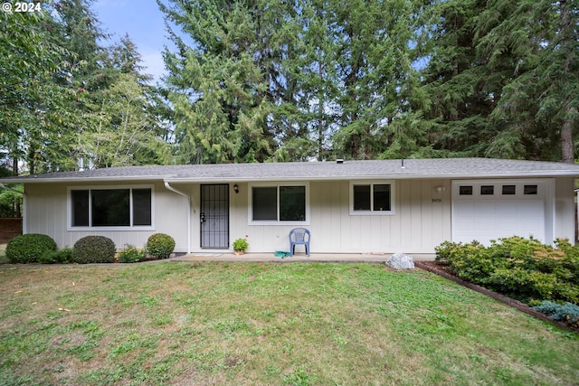 single story home with a garage and a front yard