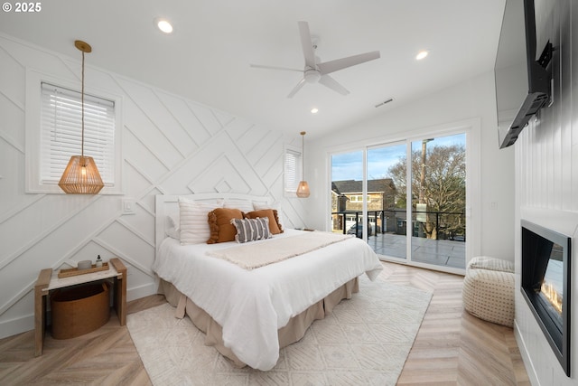 bedroom featuring ceiling fan, lofted ceiling, light parquet flooring, and access to outside