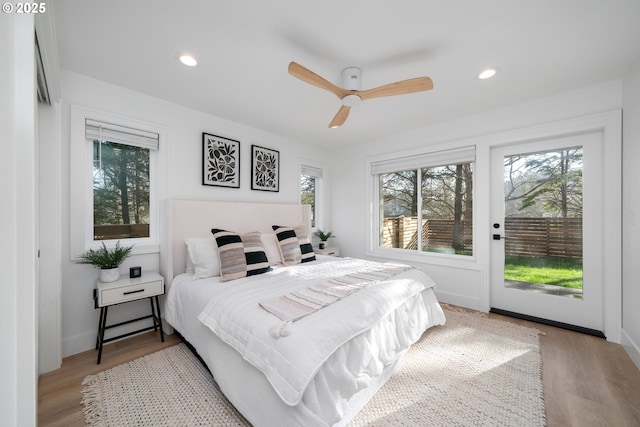 bedroom with access to outside, ceiling fan, and light hardwood / wood-style floors