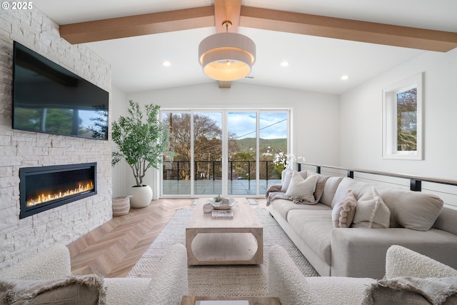 living room featuring vaulted ceiling with beams, a fireplace, and parquet floors