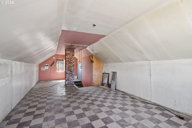 bonus room featuring decorative columns and lofted ceiling