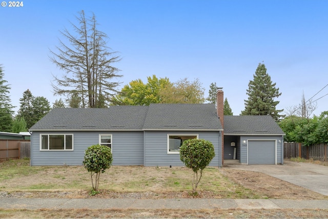 ranch-style house featuring a garage