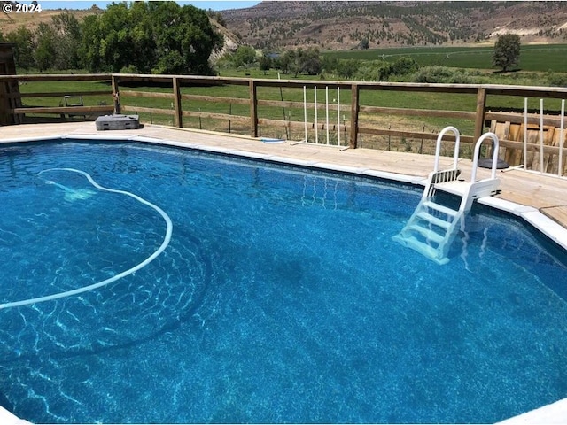 view of pool featuring a rural view