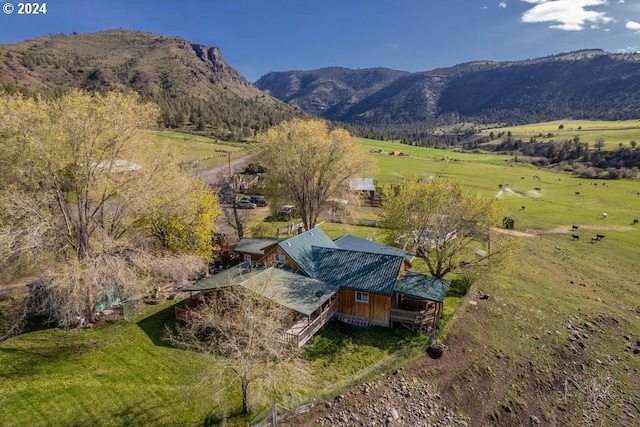 bird's eye view featuring a mountain view and a rural view