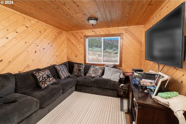 living room with wood ceiling and wood walls