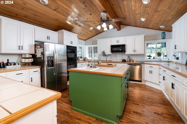 kitchen with black appliances, a kitchen island with sink, dark hardwood / wood-style flooring, and white cabinets