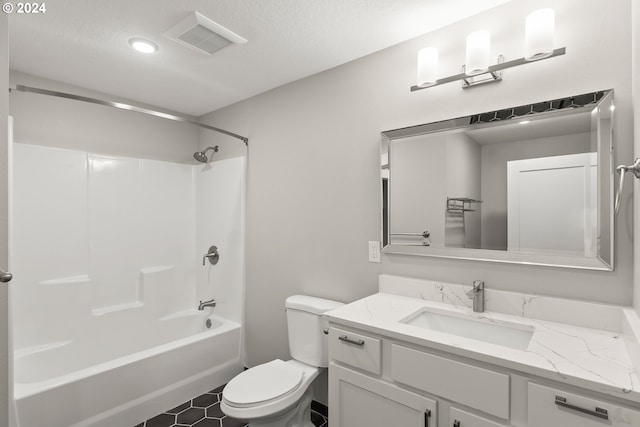 full bathroom with shower / bath combination, toilet, a textured ceiling, and vanity