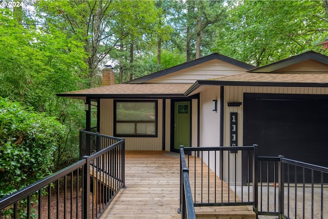 view of front of home with a wooden deck