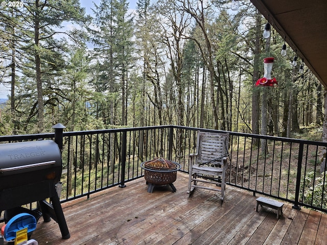1550 NW Emperor Dr, Corvallis, OR 97330 - deck with an outdoor fire pit and area for grilling