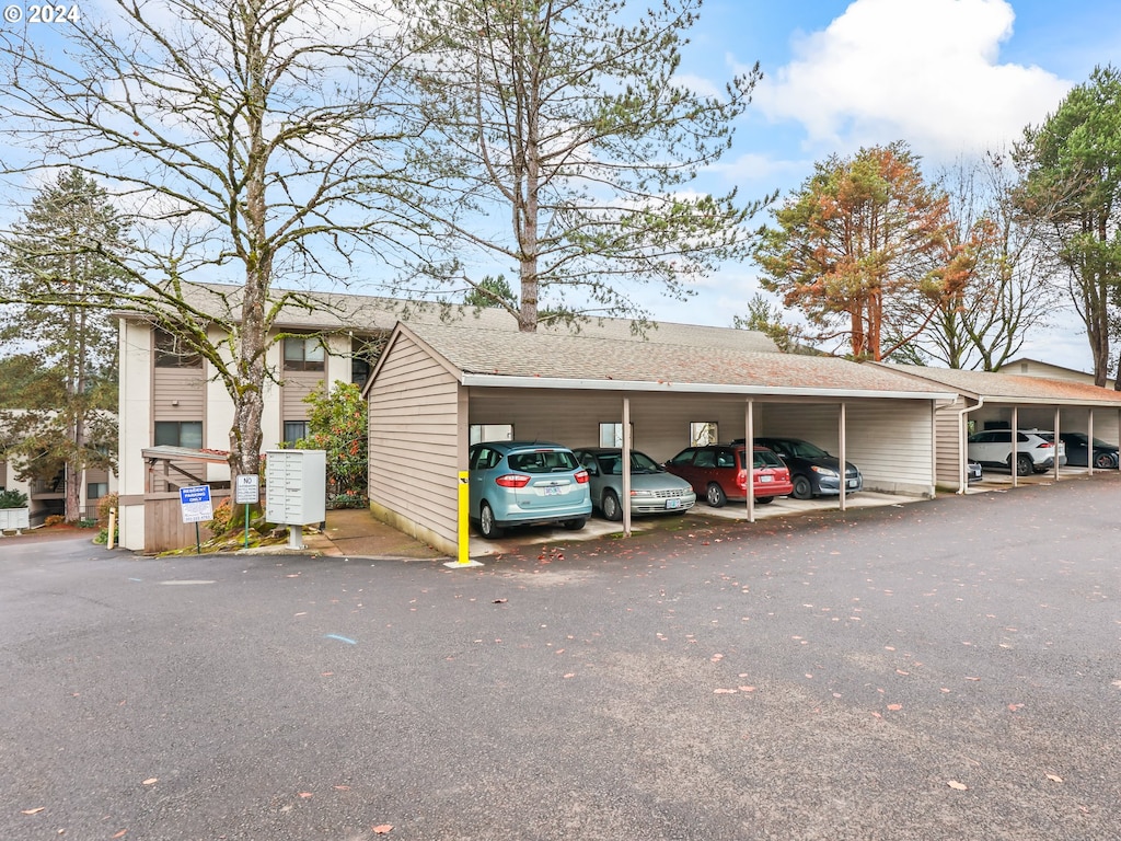 view of vehicle parking featuring a carport