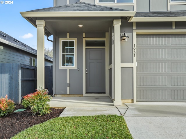 view of exterior entry featuring a garage