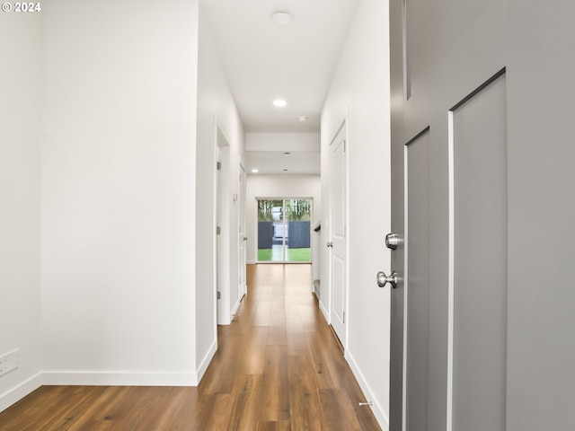 corridor with dark wood-type flooring