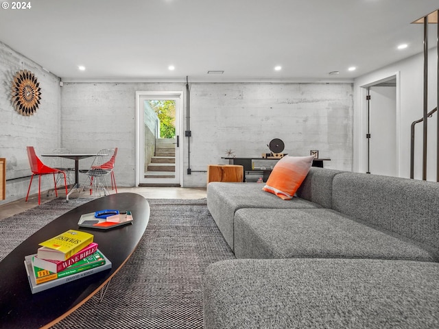 living room featuring concrete flooring