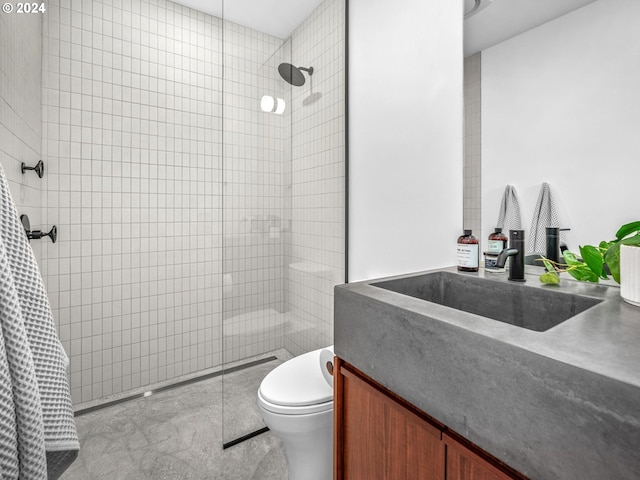 bathroom with walk in shower, vanity, and toilet