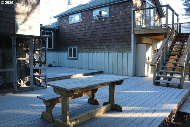 wooden terrace featuring stairway