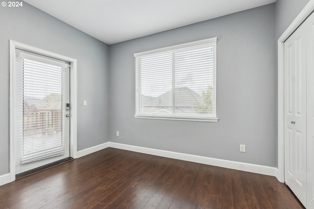 interior space with dark hardwood / wood-style floors