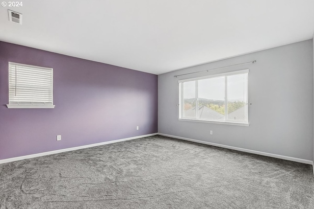 empty room featuring carpet flooring