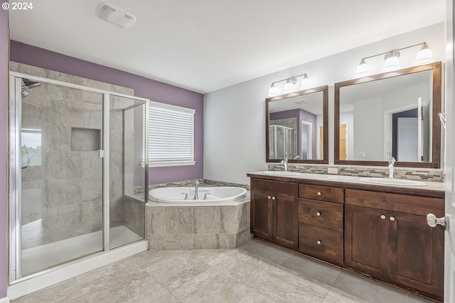 bathroom featuring vanity and plus walk in shower