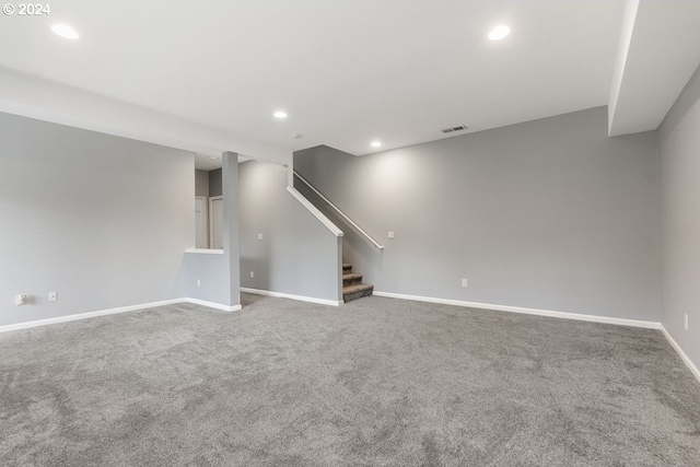 unfurnished living room featuring carpet floors