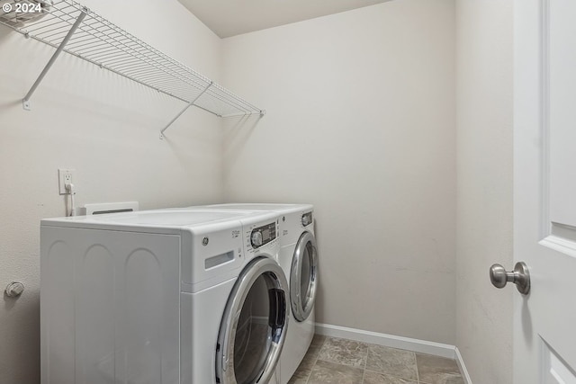 clothes washing area featuring washing machine and clothes dryer