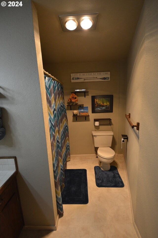 bathroom with toilet and vanity