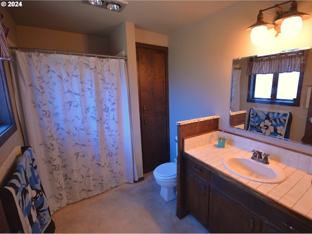 bathroom featuring vanity, toilet, a shower with curtain, and tasteful backsplash