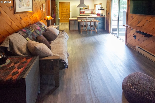 living area featuring wood walls and wood finished floors