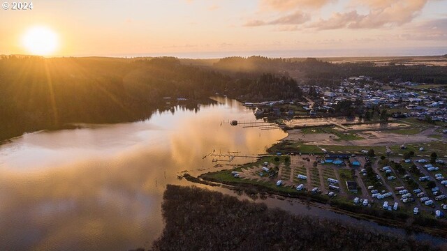 aerial view at dusk with a water view