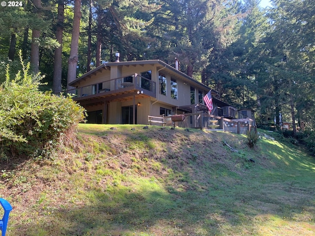 back of house featuring a wooden deck