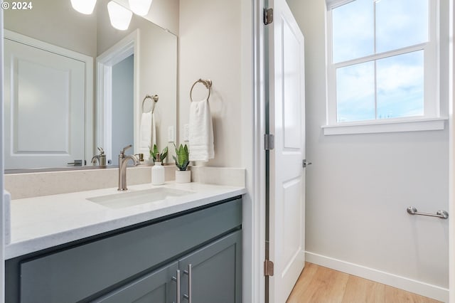 bathroom with vanity and hardwood / wood-style floors