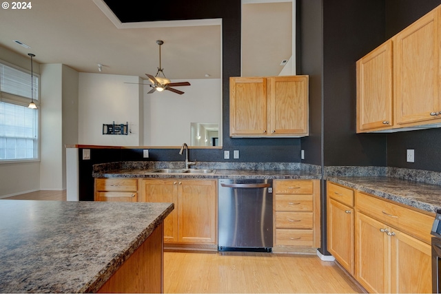 kitchen with light brown cabinetry, stainless steel dishwasher, ceiling fan, sink, and light hardwood / wood-style floors