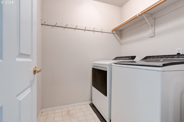 clothes washing area with independent washer and dryer