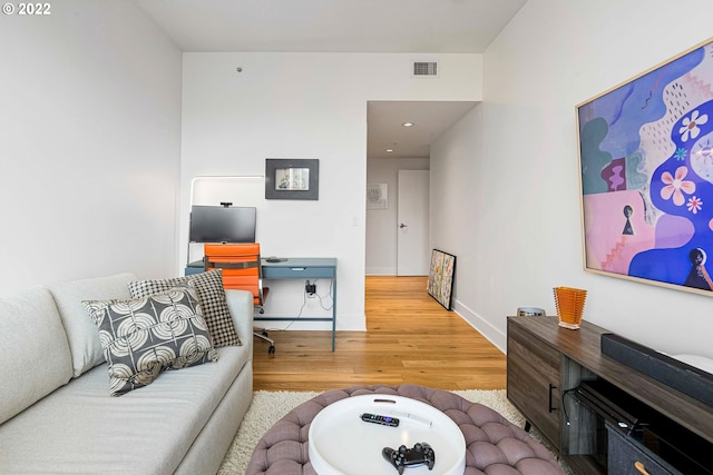 living room with light hardwood / wood-style floors