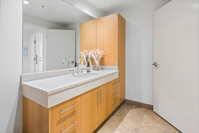 bathroom with vanity and tile patterned flooring