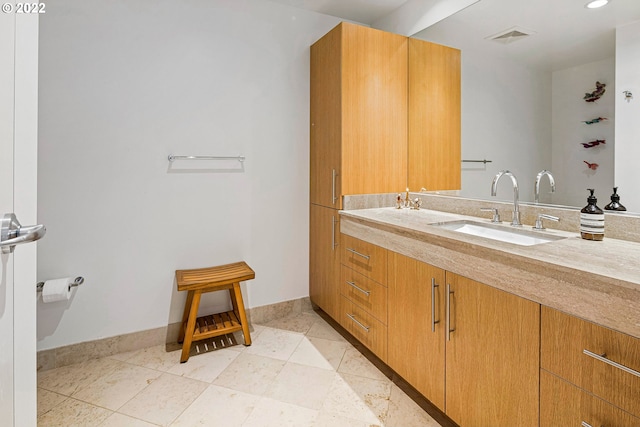 bathroom with vanity and tile patterned flooring