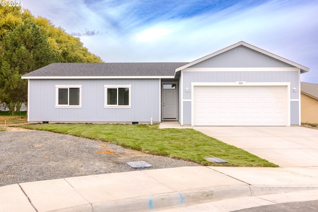 single story home with a garage and a front lawn