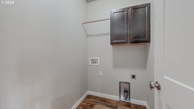 washroom with washer hookup, hookup for an electric dryer, cabinets, and dark hardwood / wood-style flooring