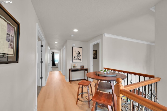 corridor with light hardwood / wood-style flooring