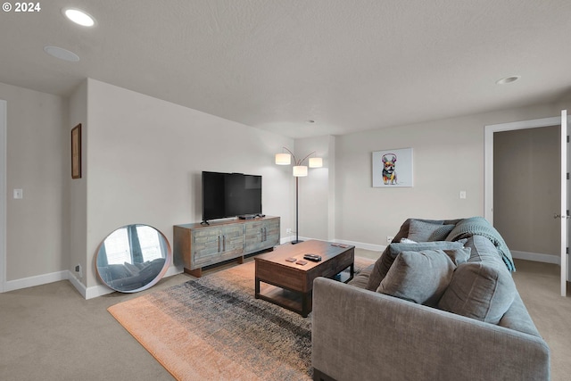 living room with light carpet and a textured ceiling