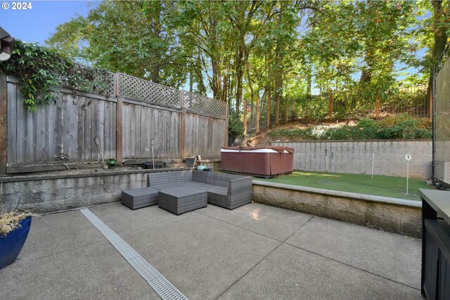 view of patio with a hot tub