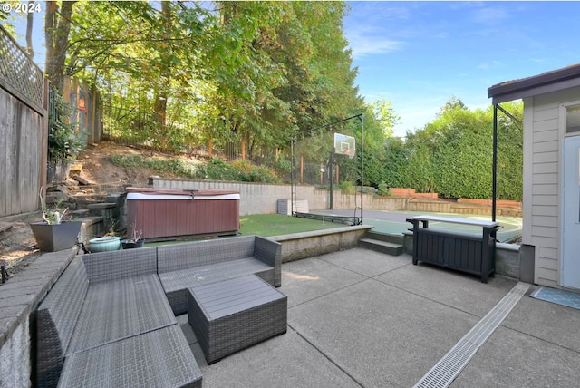 view of patio / terrace featuring a hot tub