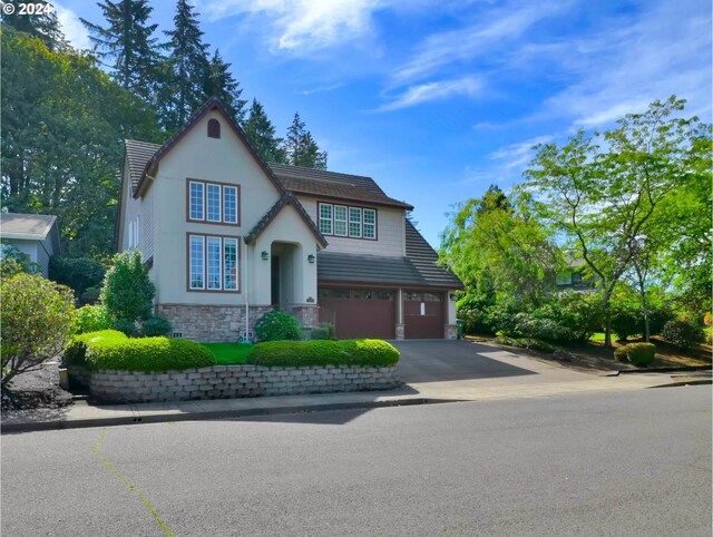 tudor-style house with a garage