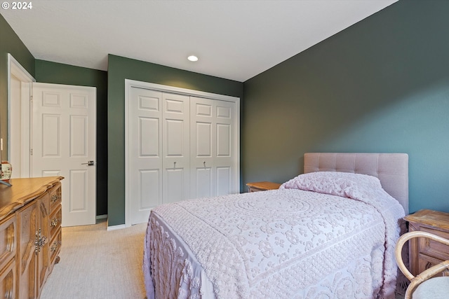 carpeted bedroom featuring a closet