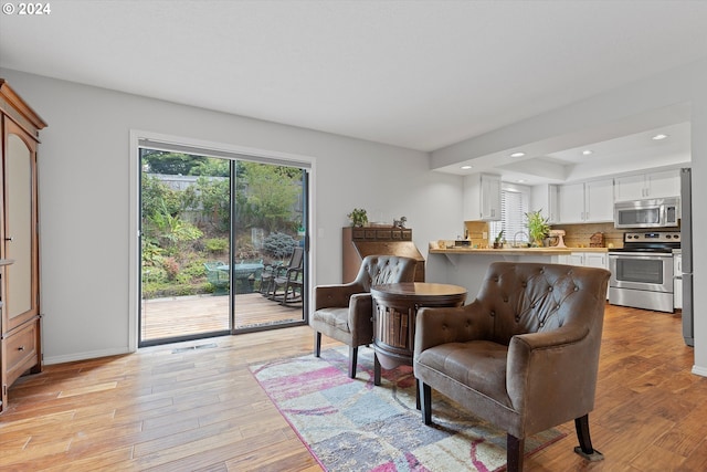 living area featuring light hardwood / wood-style floors