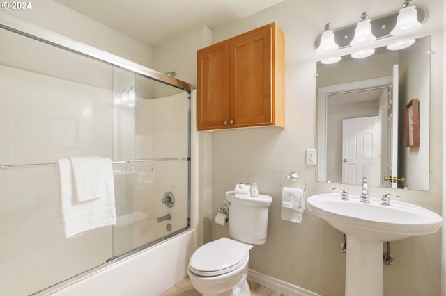 bathroom featuring toilet and enclosed tub / shower combo