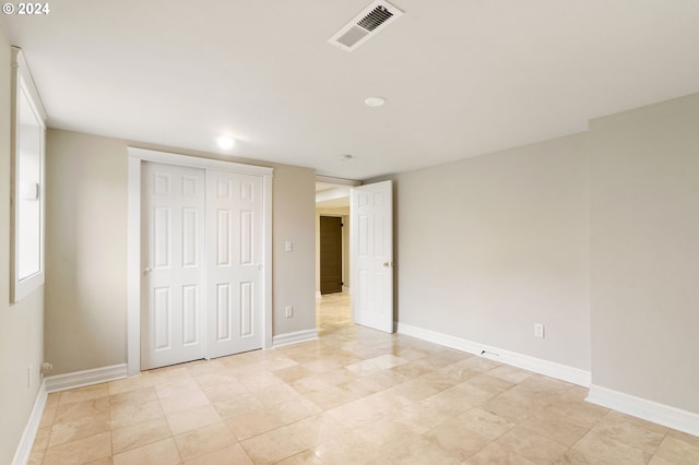 unfurnished bedroom with a closet