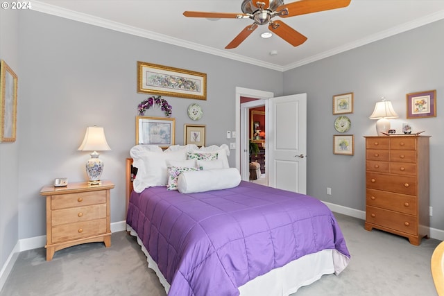 bedroom with light colored carpet, ornamental molding, baseboards, and a ceiling fan