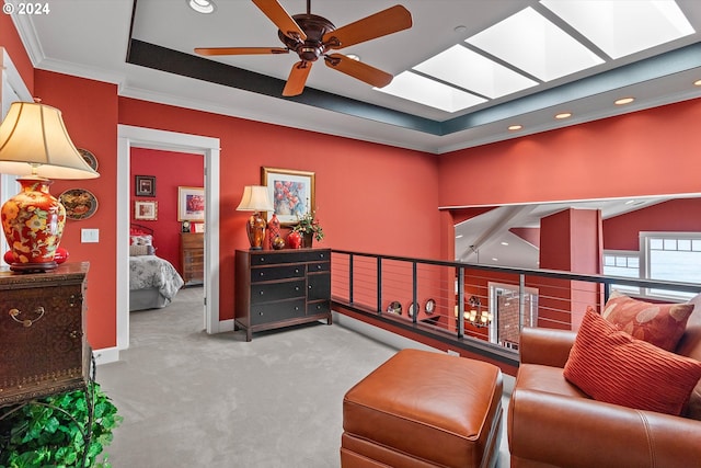 sitting room with carpet flooring, ceiling fan, recessed lighting, baseboards, and a tray ceiling